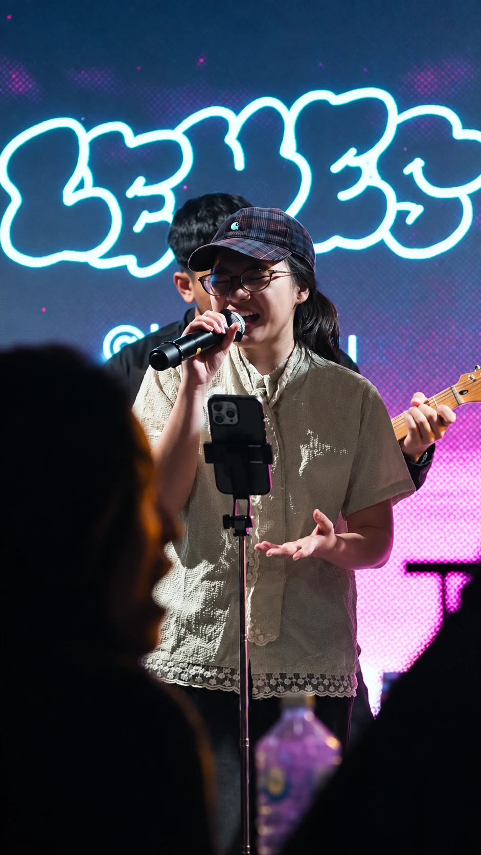 A vocalist performing live at Jaya