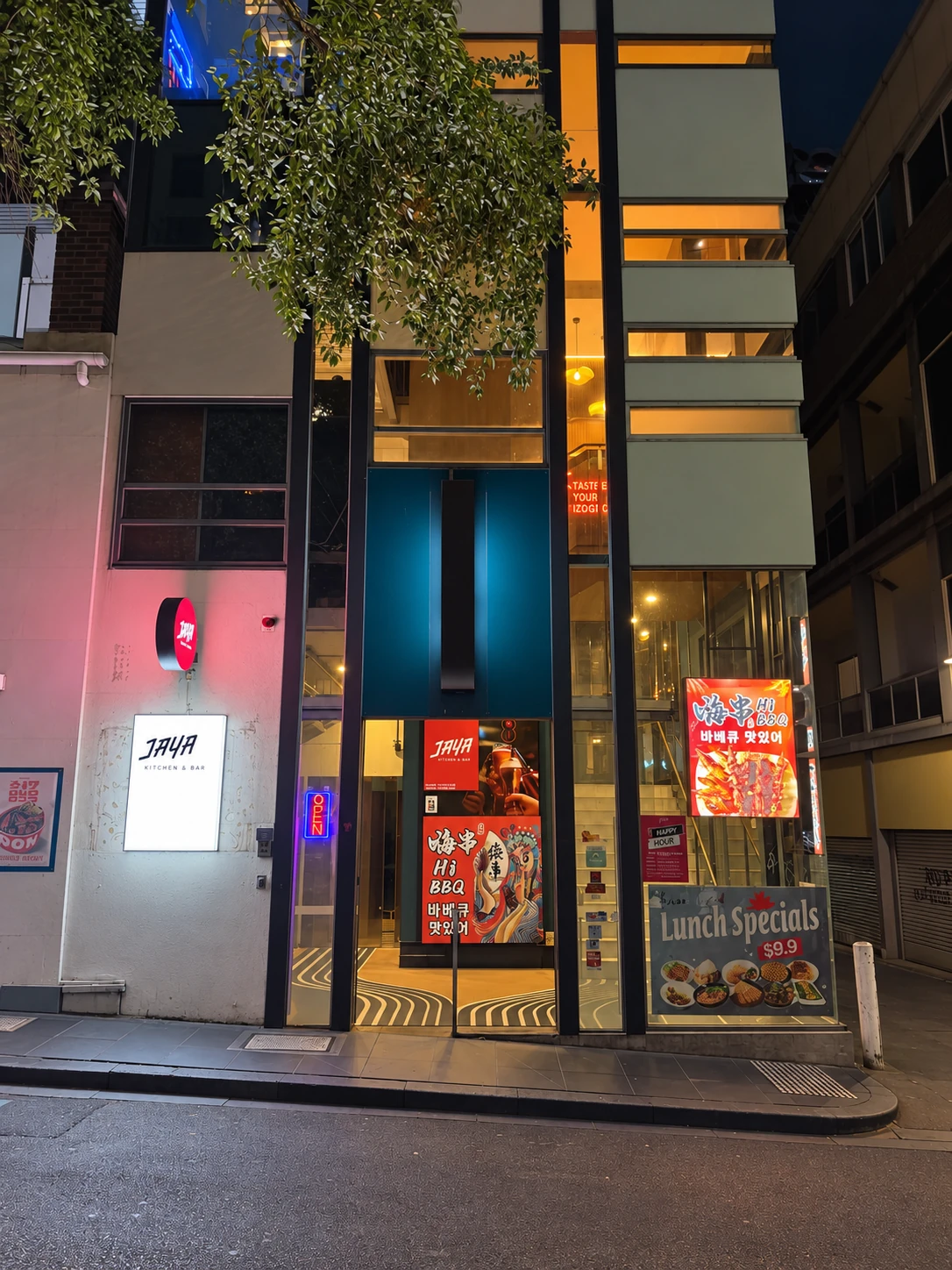 The same entrance to Jaya illuminated at night